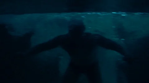 Silhouette of a man in a swimming pool Stock Footage 129106069