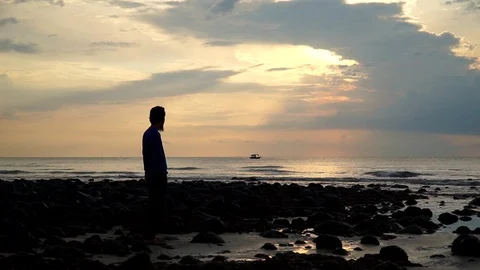 Silhouette man texting using phone at the beach. Video stock 94562722