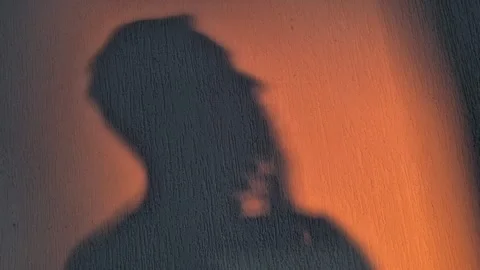 The silhouette of a man thinking about something Stock Footage 311391304