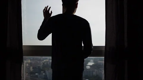 Silhouette of man touching window in slow motion Video stock 88772201