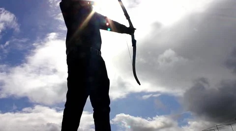 Silhouette of man using bow and arrow, archery Stock Footage 49079172