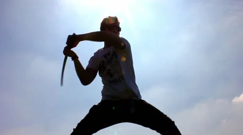 Silhouette of man using a samurai sword / katana Stock Footage 48975889