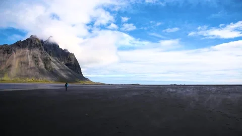 Silhouette of a man walking between steam and fog near most breathtaking mo.. Stock Footage 260916481