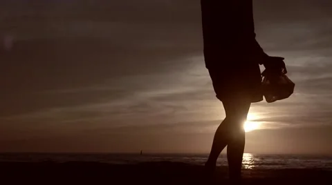 Silhouette of man walking by in sunset Stock-Footage 45519714