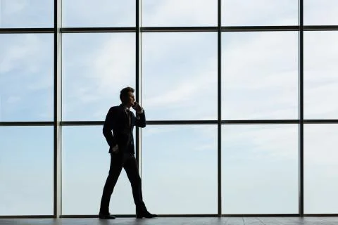 Silhouette of man at the window Stock Photos