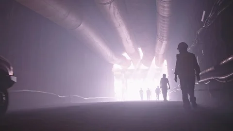 Silhouette of many construction workers walking out from a large tunnel Video stock 92185807