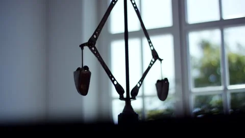 Silhouette of Mechanical Device with Hanging Weights, Bright Window, Close Up Stock Footage 341441899