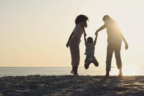 Silhouette, mock up and a family on a beach, playing while having fun together Stock Photos