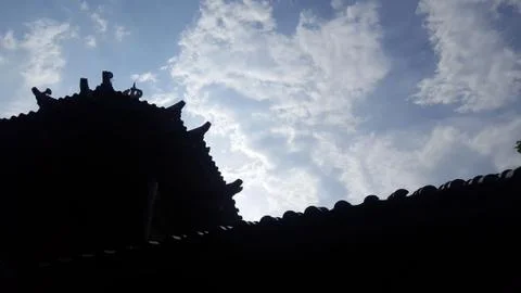 Silhouette of mosque against the clouds Stock Photos