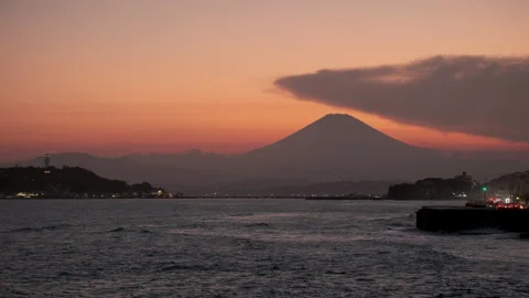 Silhouette of Mount Fuji at Sunset over Sagami Bay from Kamakura Coast Stock Footage 337693302