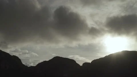 Silhouette Mountain with flare sunlight, Cloud moving on sky Stock Footage 153505262