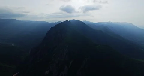 Silhouette Of Mountain Peak Rays Of Sun Shining Depth Mountain Range Aerial Video stock 300479619