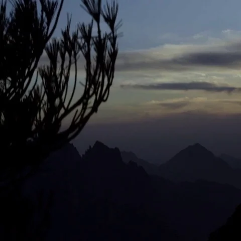 Silhouette mountains and dramatic sky at dusk Stock Footage 69456312