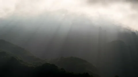 Silhouette of mountains and sunbeams.Time Lapse Stock Footage 67547341