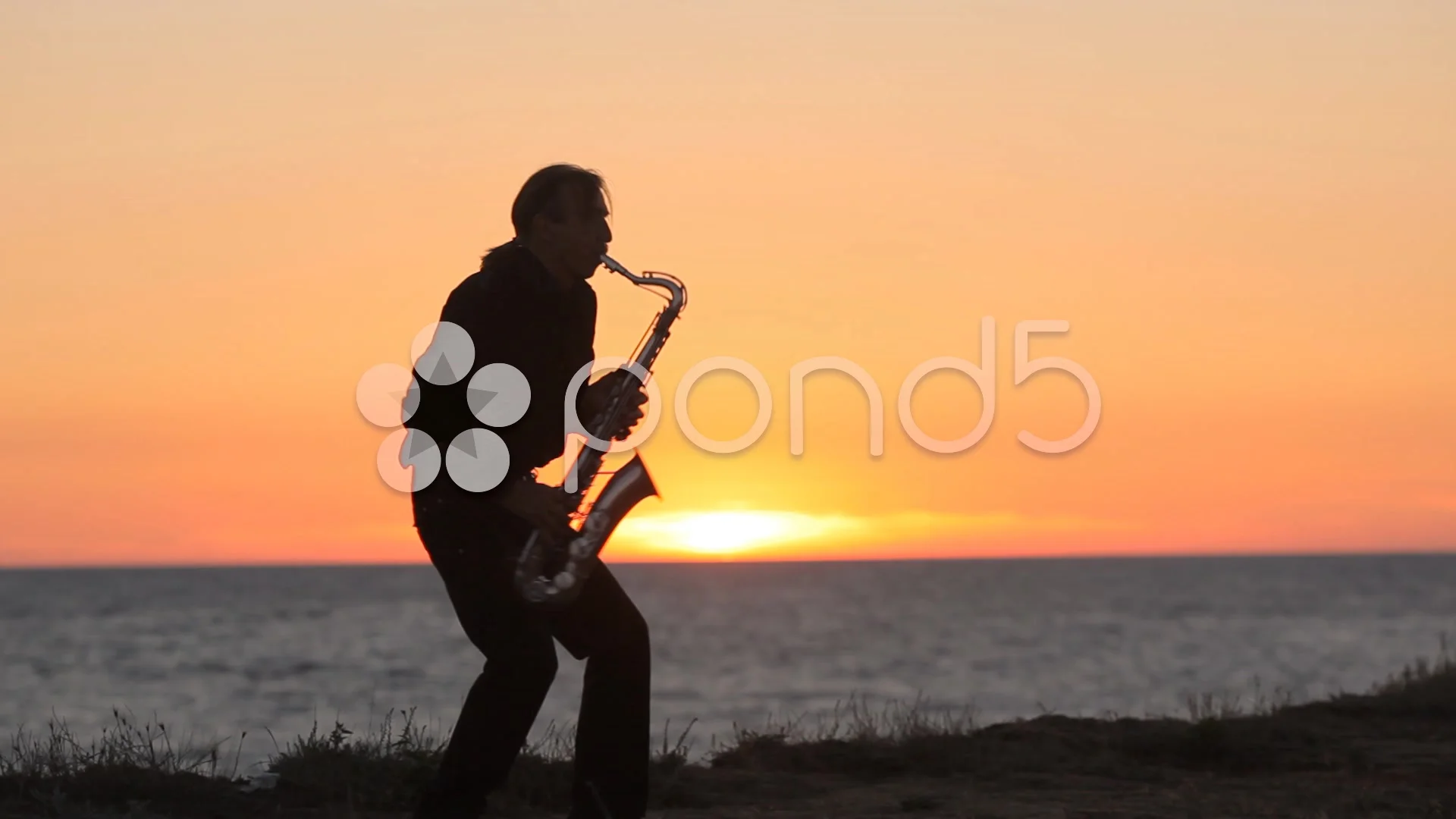 Get cold second Breaking news The silhouette of a musician playing sax... | Stock Video | Pond5