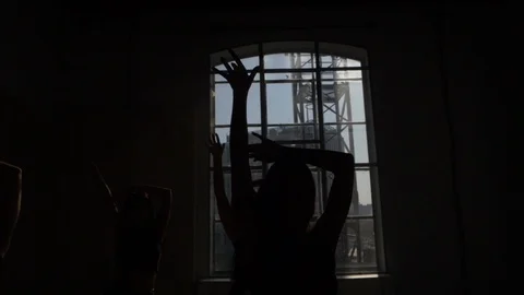 Silhouette mystically dancing the window against daylight Contre jour 스톡 동영상 125529981