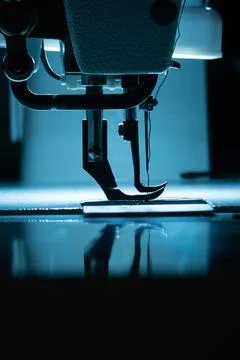 The silhouette of the needle with thread in the sewing machine Stock Photos