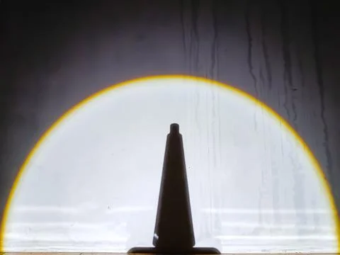 Silhouette Object in Front of Moonlike Light Reflection Stock Photos