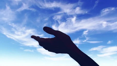 Silhouette of an open hand blue sky clouds moving loop background Stock Footage 339997814