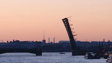 Silhouette of opened Trinity Bridge on the Neva early morning Видео 85471310