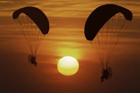 Silhouette paramotor at sunset 库存照片