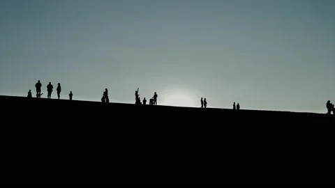 Silhouette park visitors slow motion fades 4K Stock Footage 196656152