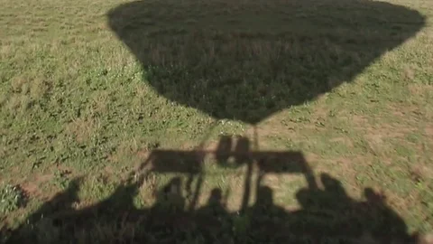 Silhouette of passengers in hot air balloon, Serengeti Stock Footage