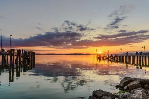 Silhouette of people on a dock Stock Photos