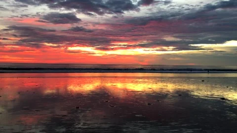 Silhouette of people during sunset overlooking the beautiful Kuta Beach in Bali Stock Footage 249048272