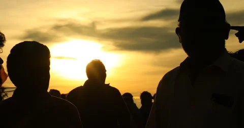 Silhouette of people in sunset Stock Footage 327080587