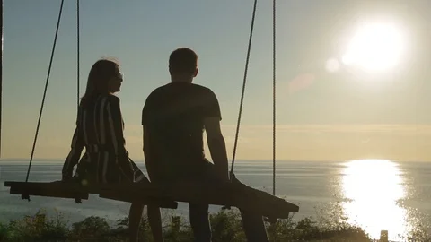 Silhouette of people on the swing Stock Footage 95930320