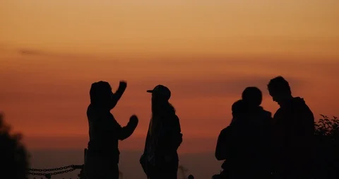 Silhouette of people watching the Lunar Eclipse in Los Angeles, California Stock Footage 99158934