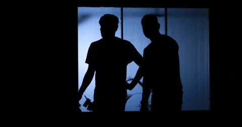 Silhouette of people at window Video stock 184929010