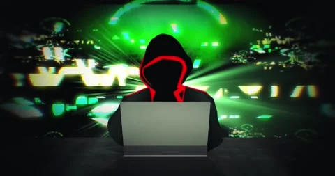 Silhouette of person at desk programming a virus on laptop - Zoom in Stock Footage 130806225