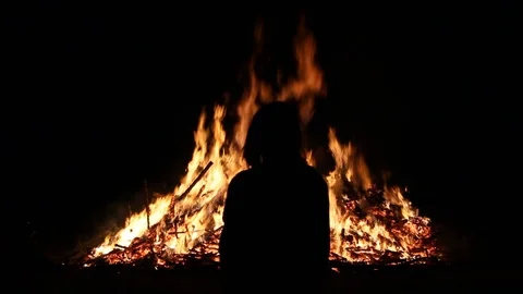Silhouette of person in front of massive fire Stock Footage 122306629