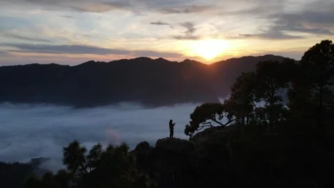 Silhouette of a person in the mountains Stock Footage 296897697