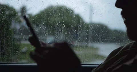 Silhouette Of Person Using Smartphone Inside Car... Video stock 332075247