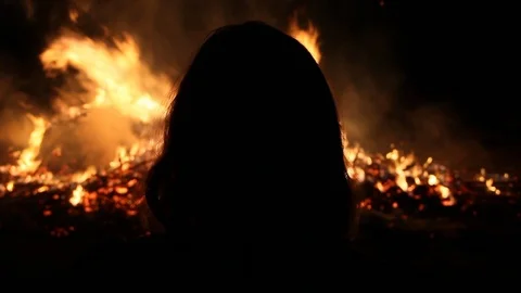 Silhouette of person's head with fire in... | Stock Video | Pond5