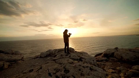 Silhouette Of Photographer With Camera On Background Of Ocean Surface Stock Footage 124786116