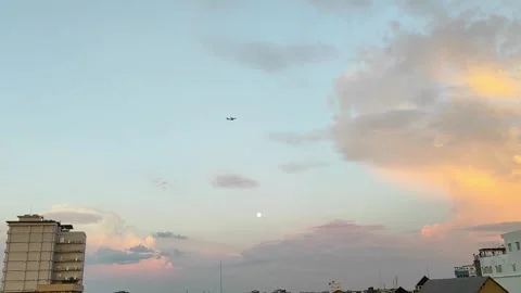 A silhouette of a plane flying on the sky Stock Footage 268352728