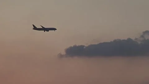 Silhouette of a plane landing Stock Footage 292279574