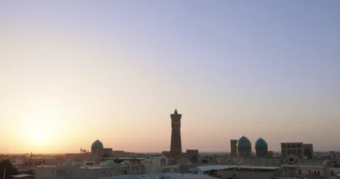 Silhouette of Po-i-Kalyan complex at sunset. Old Bukhara panorama at sunset Stock Footage 269853199