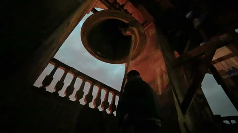 Silhouette of priest ring the bell Stock Footage 34040495