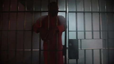 silhouette-prisoner-behind-bars-american