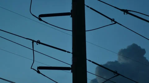Silhouette of public electricity system with clouds moving behind 스톡 동영상 39354441