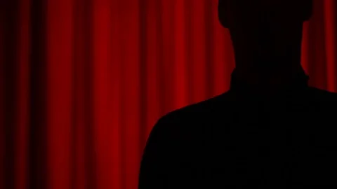 Silhouette puts on coat 2 Stock Footage 87201453
