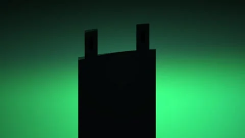 Silhouette of a rectangular object with two protrusions on a green gradient.. Stock Footage 337517761