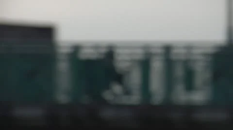 Silhouette Riding Bicycle on Bridge Stock Footage 22322468