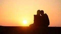 boy and girl hugging silhouette