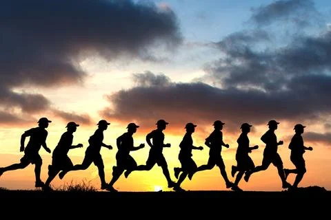 Silhouette of a runner on a colored background with clipping path. Stock Photos